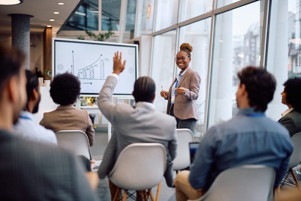 Young business professionals participating in a seminar to improve their skills