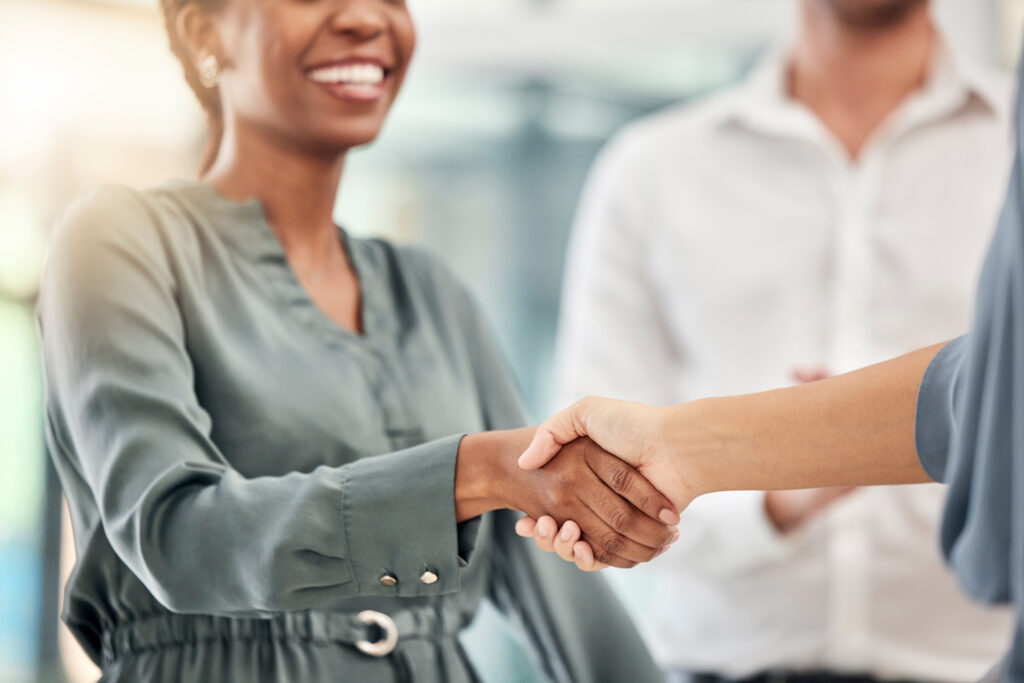 Two business professionals shaking hands